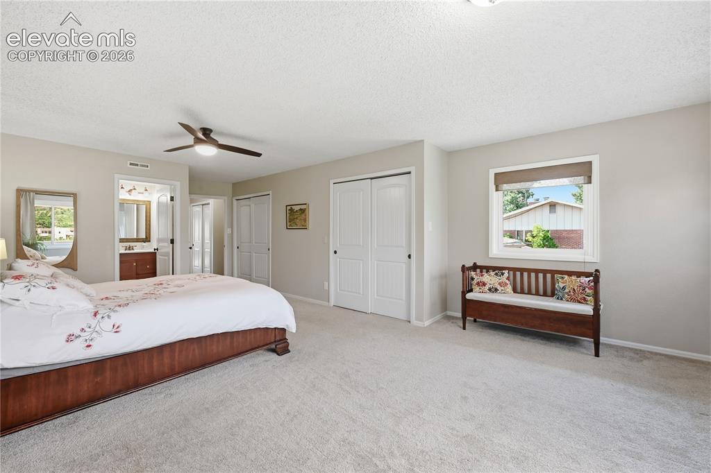 Image 28 of 44: Upper Level HUGE primary bedroom, room for sitting area and west facing vie