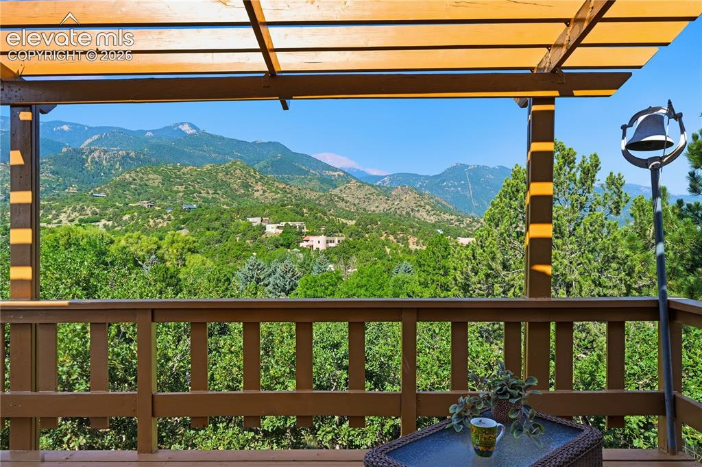 Image 31 of 44: Upper level deck off of primary bedroom and the VIEWS!