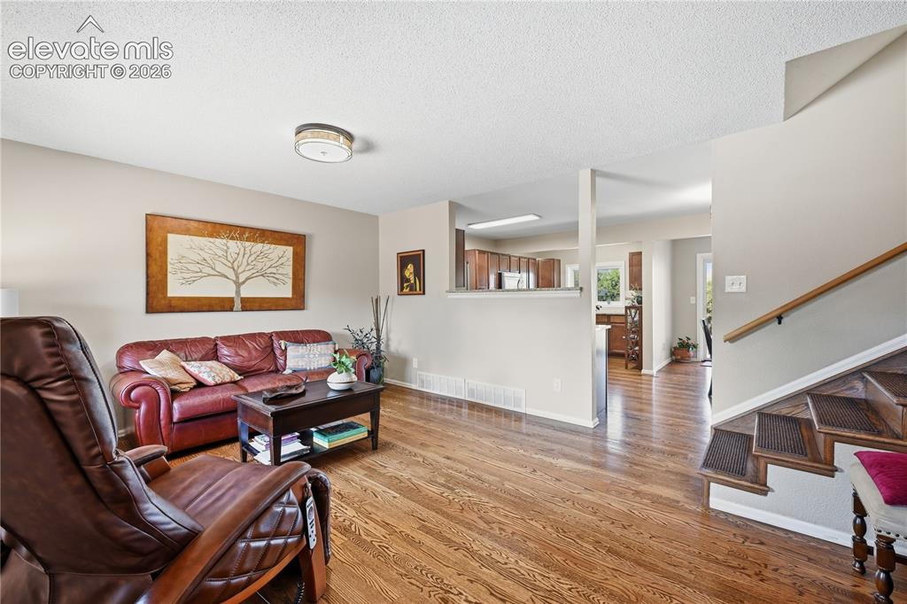 Image 4 of 44: View of main floor from entry of home.