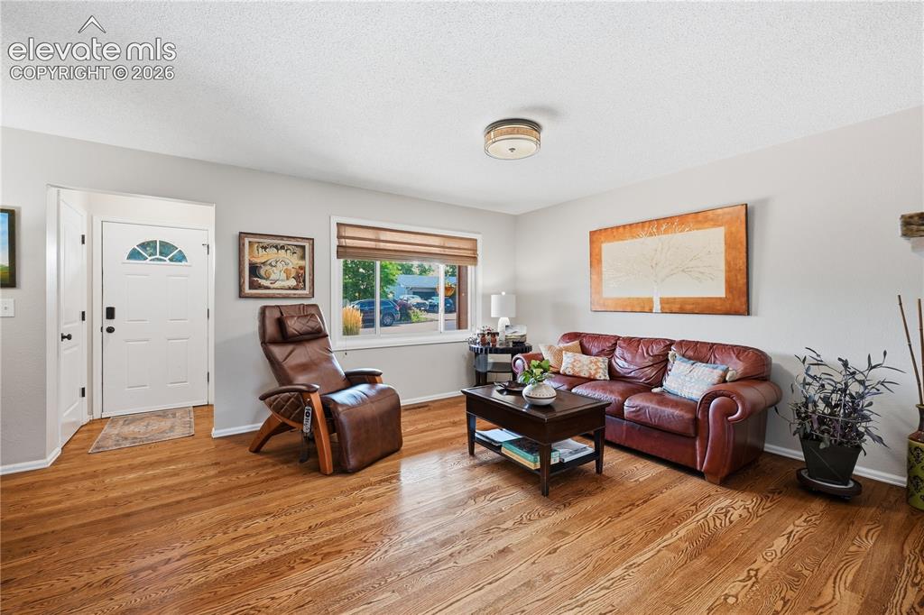 Image 5 of 44: Gorgeous hardwood floors installed in 2017 throughout the main level and st