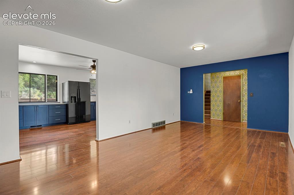 Image 8 of 35: Wood-finish flooring throughout, with flush-mount ceiling lighting