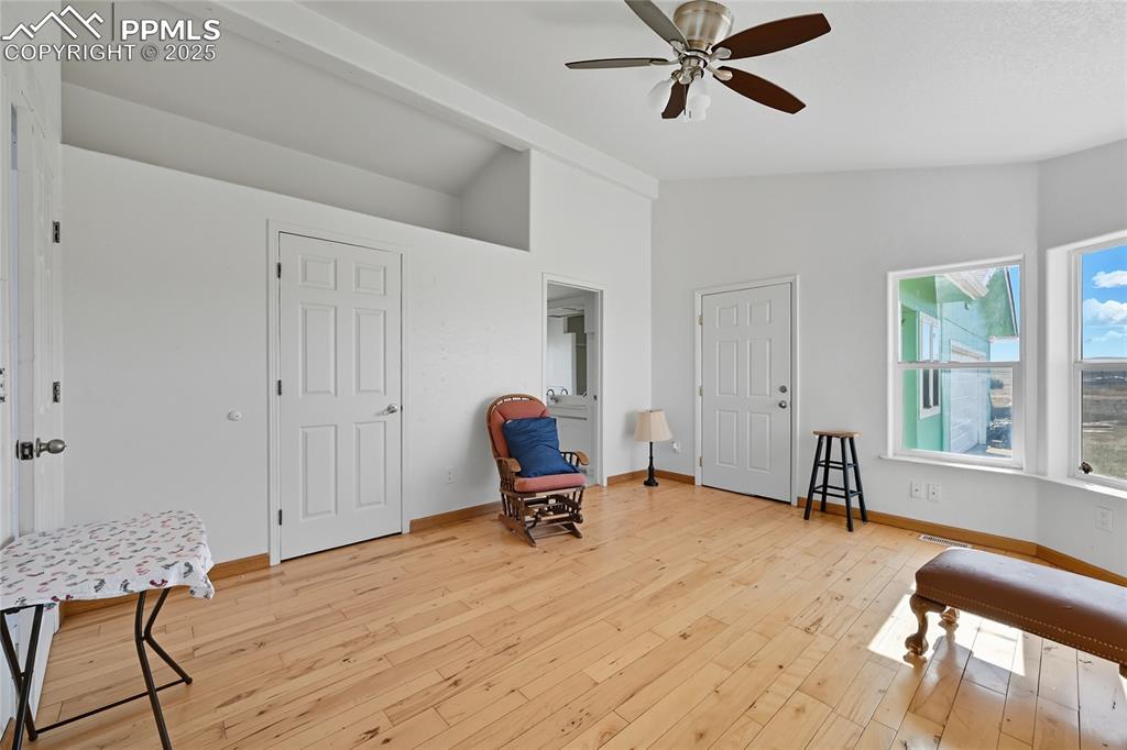 Image 6 of 28: Sitting room featuring vaulted ceiling, light wood-style floors, and a ceil