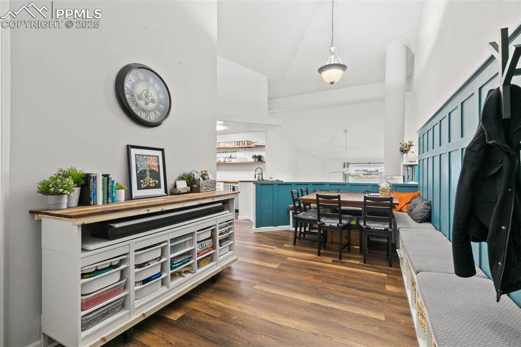 Image 5 of 27: Dining room with dark wood-style floors