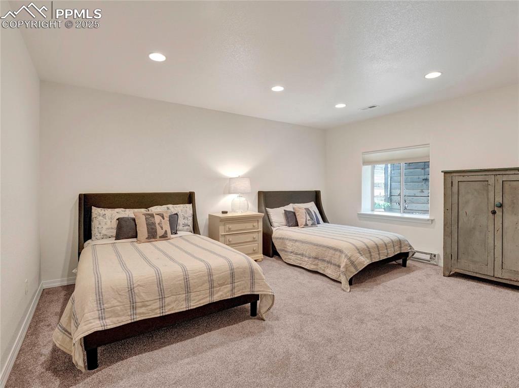 Image 35 of 44: Bedroom featuring carpet floors, recessed lighting, and baseboards