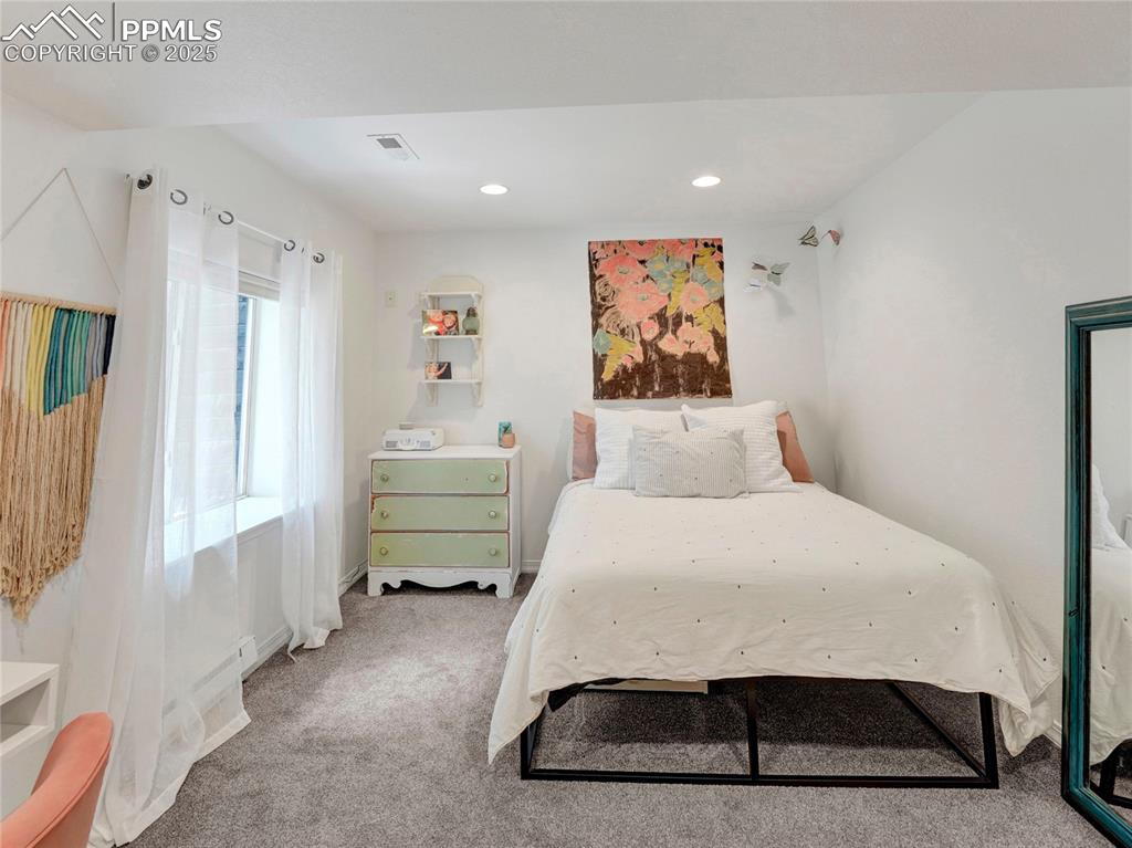 Image 38 of 44: Carpeted bedroom featuring recessed lighting and baseboards