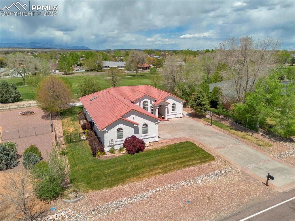Image 4 of 44: Aerial view of property and surrounding area