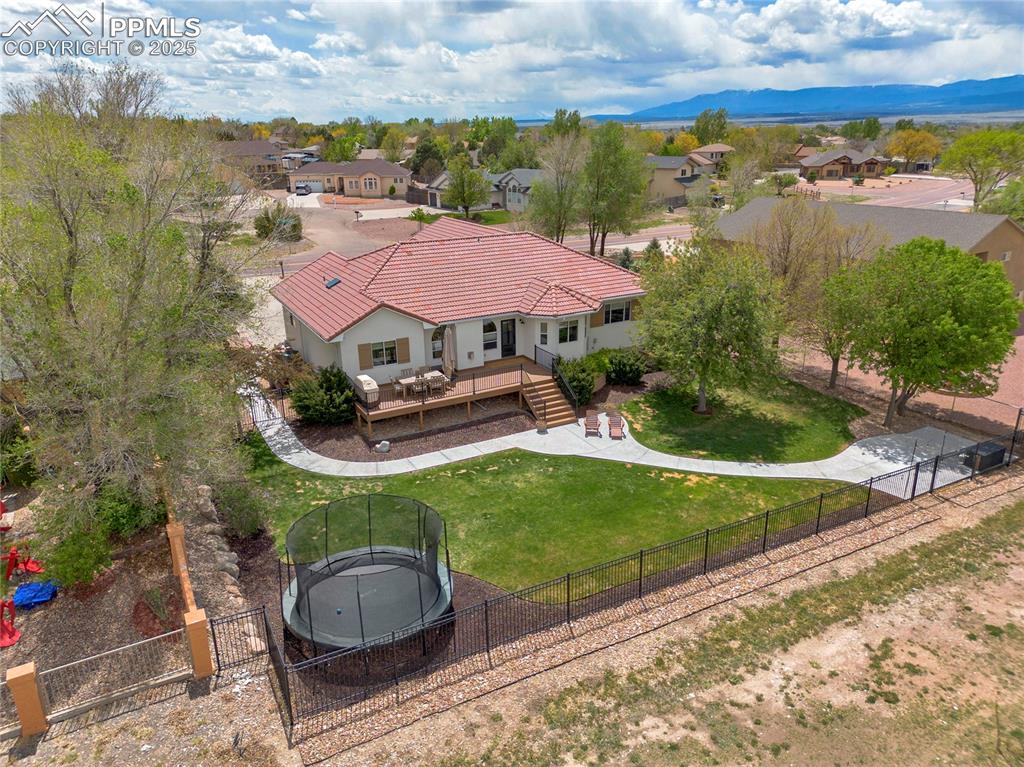 Image 42 of 44: Aerial perspective of suburban area with mountains