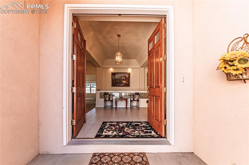 Image 3 of 49: View of exterior entry with stucco siding