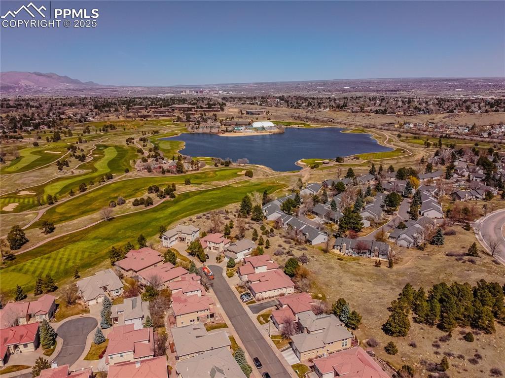 Image 44 of 49: Drone / aerial view featuring view of golf course, a residential view, and 