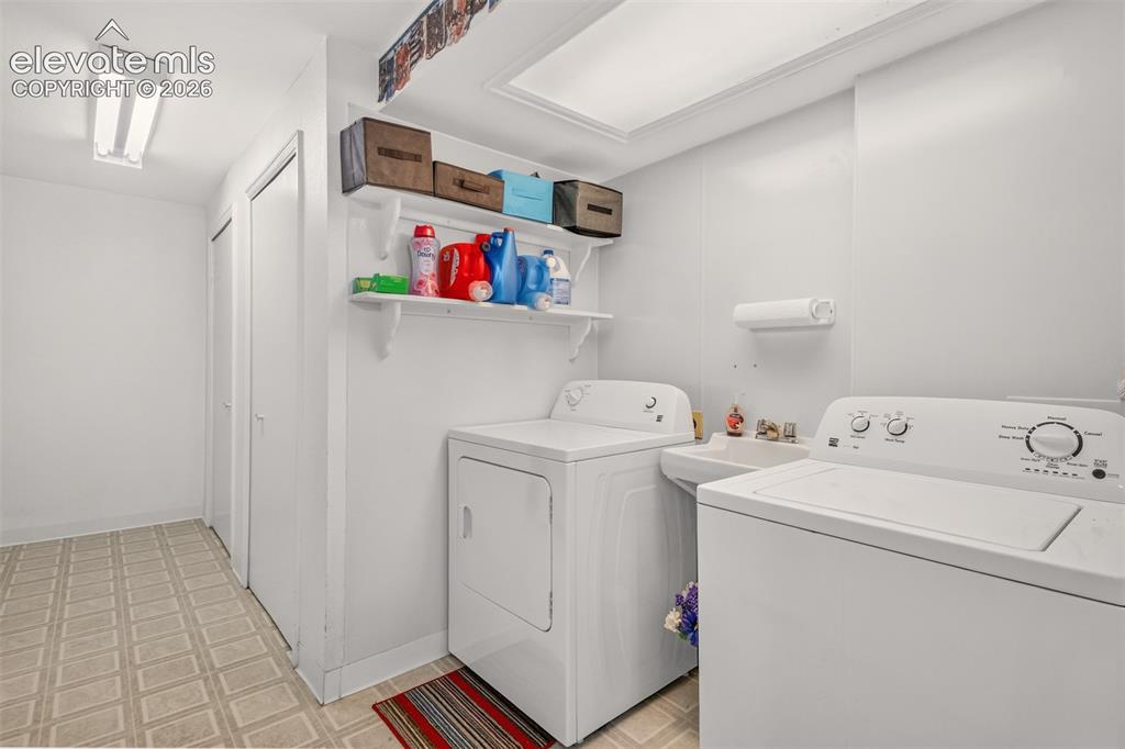 Image 20 of 27: Laundry Room with Washer and Dryer Included