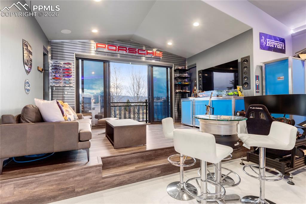 Image 44 of 46: Detached garage with "mancave" and car lift. 