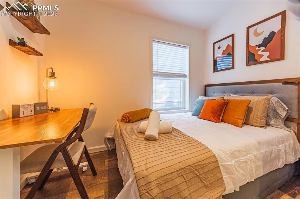 Image 22 of 27: Bedroom with baseboards
