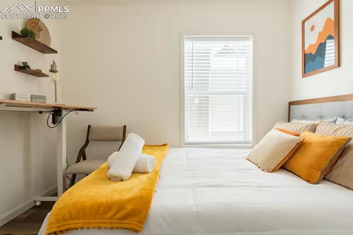 Image 23 of 27: Bedroom featuring baseboards