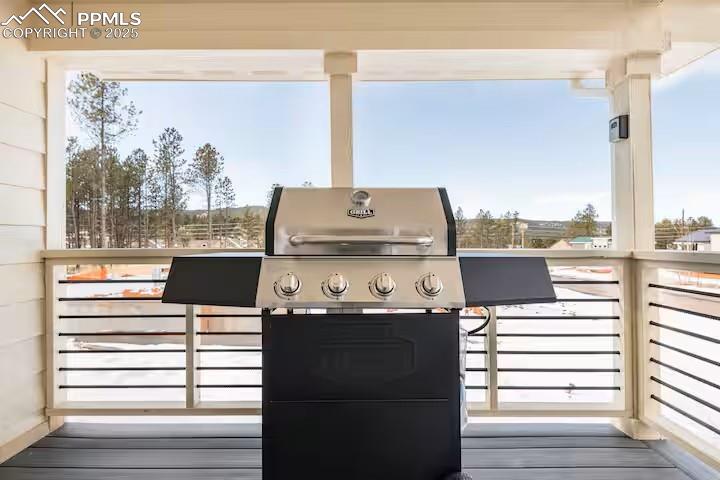Image 5 of 27: Wooden deck featuring a grill