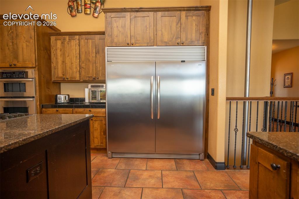 Image 13 of 47: A true full size side-by-side built-in refrigerator/freezer
