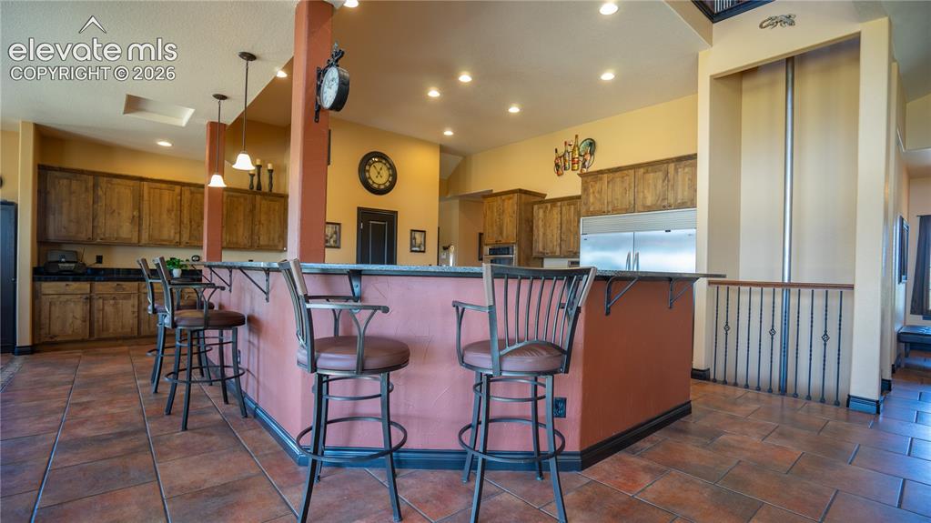 Image 14 of 47: Come together w/family & Friends in this welcoming, open kitchen