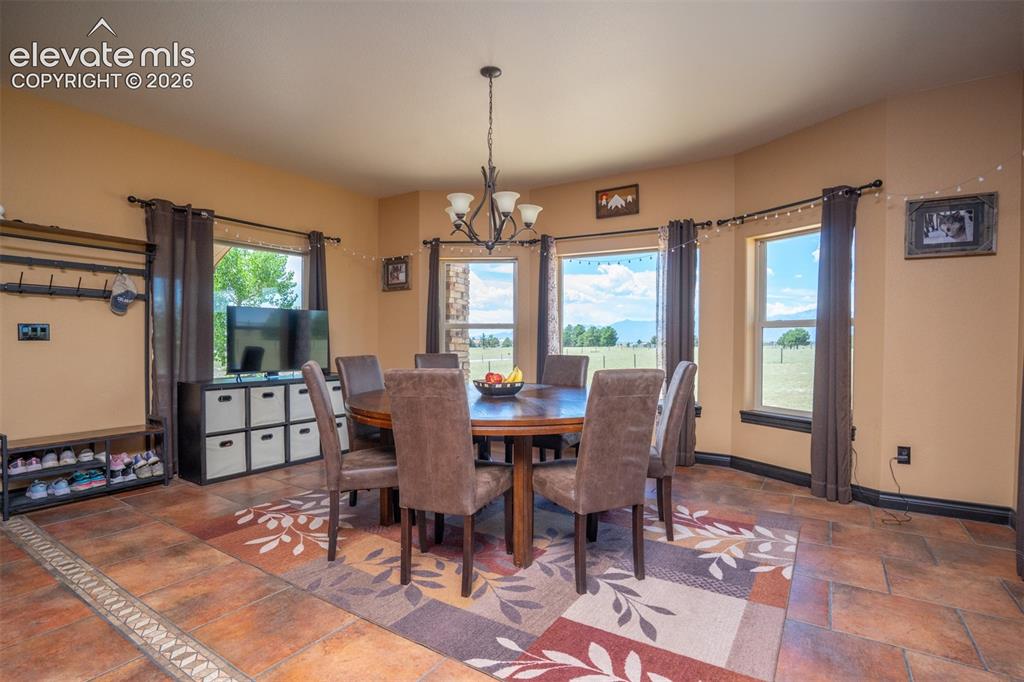 Image 15 of 47: The dining area was created to also maximize the views