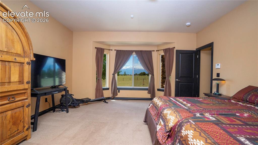 Image 18 of 47: The Primary bedroom is 17x16 and also has the fabulous views
