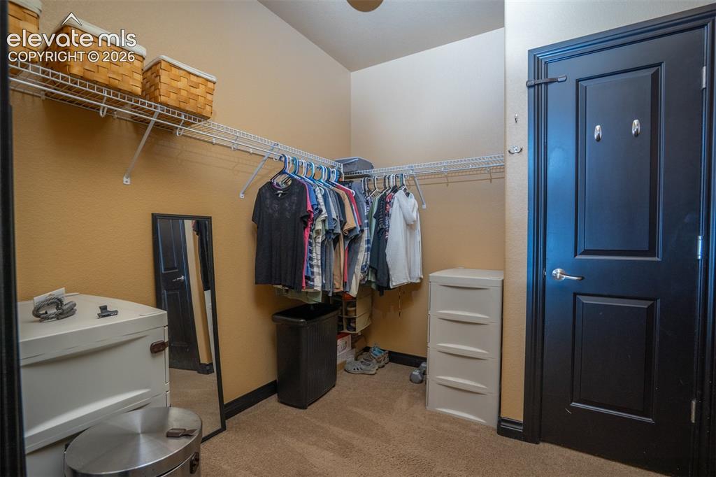 Image 21 of 47: This closet is quite large and offers a passage to the basement - shhhh!