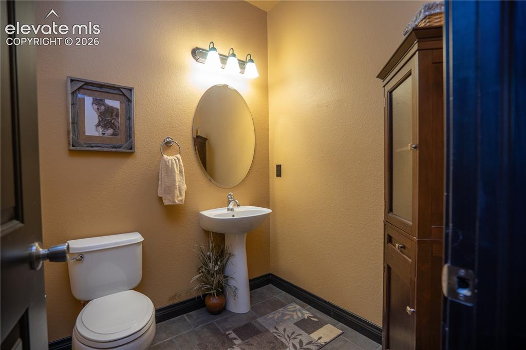 Image 23 of 47: This powder bath is located off the Office