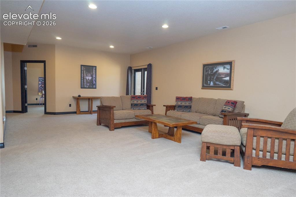 Image 28 of 47: Entertainment space is plentiful in this basement area