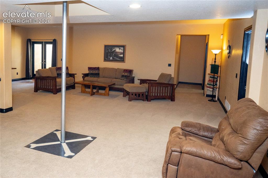 Image 29 of 47: The firepole comes straight down from the loft above the main area