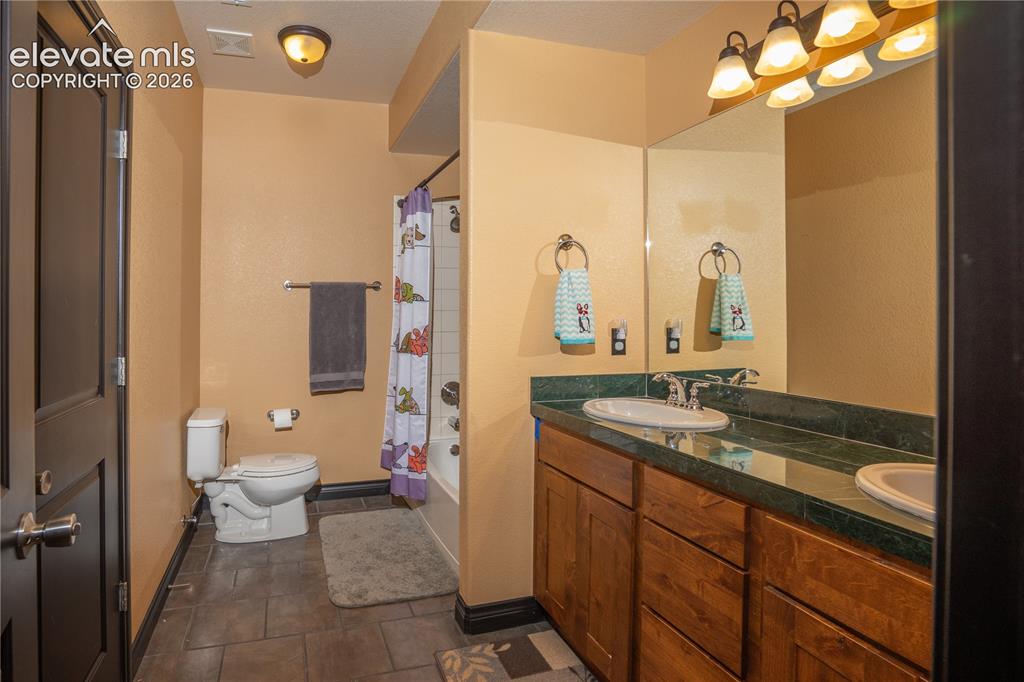 Image 35 of 47: Sep bath serves Bdrm #5 in the home
