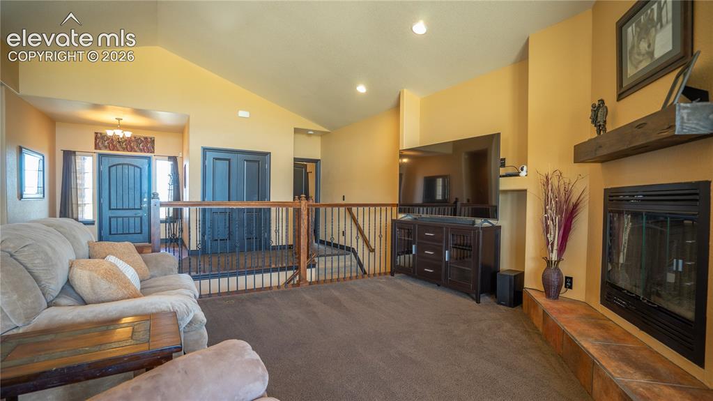 Image 9 of 47: A true wood burning fireplace is the central focus of this living rm