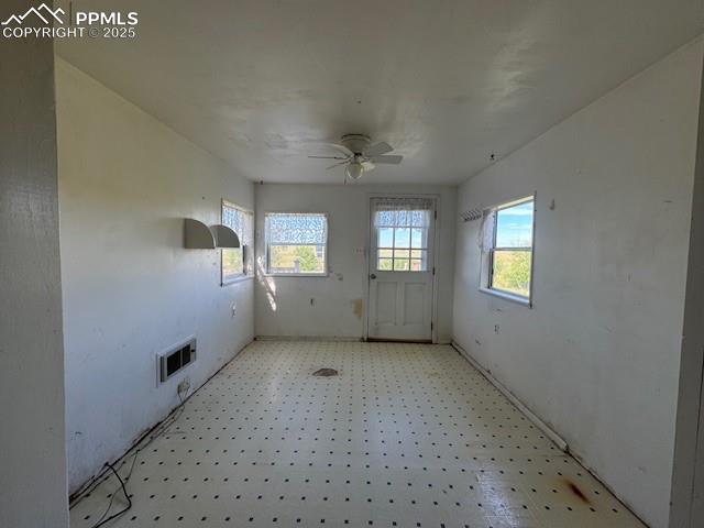 Image 7 of 17: Empty room featuring a ceiling fan