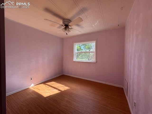 Image 8 of 17: Unfurnished room with wood finished floors and a ceiling fan