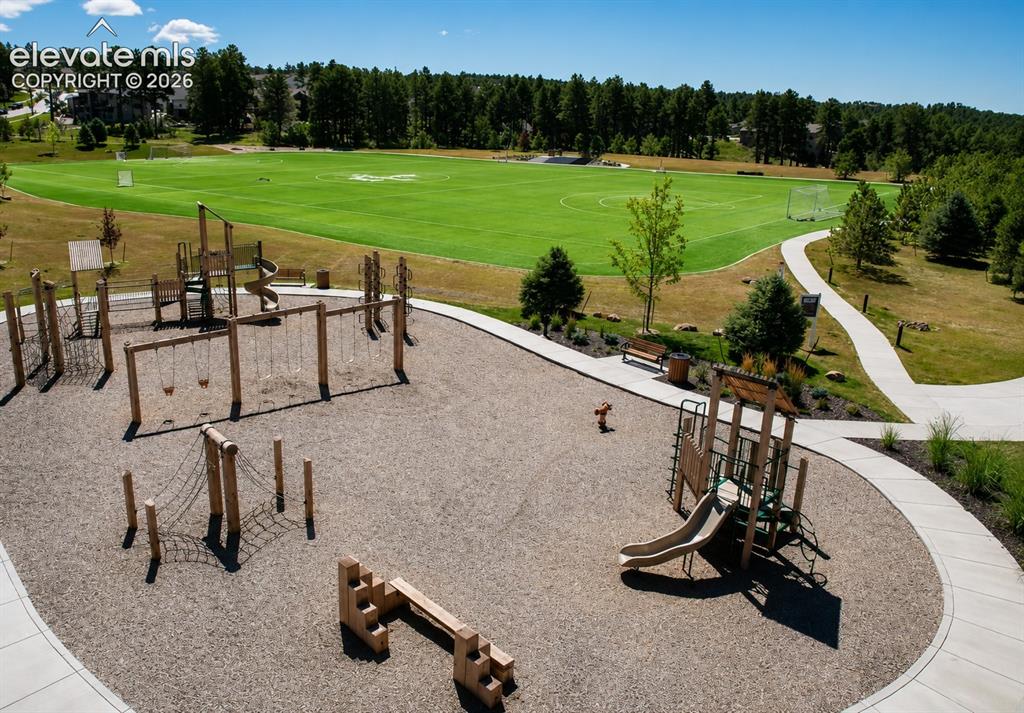 Image 48 of 50: Sanctuary Park: 8-acre community park with a 5-acre turf field, playground,