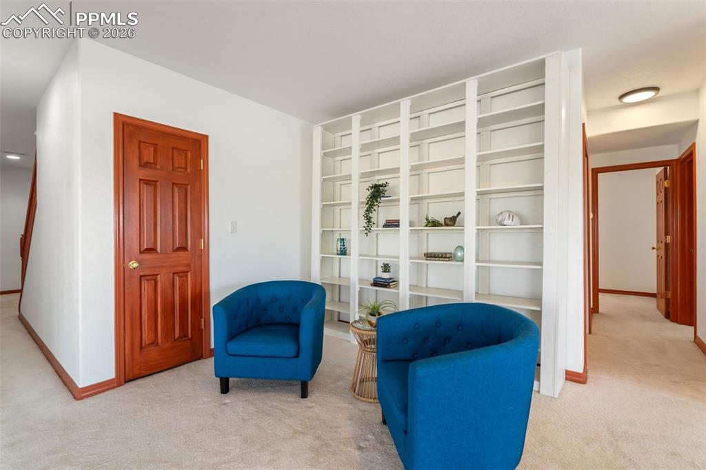 Image 20 of 33: Large open area in basement, walks out to lower deck