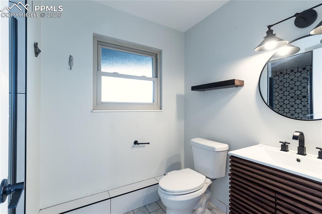 Image 27 of 48: Bathroom featuring vanity and a shower