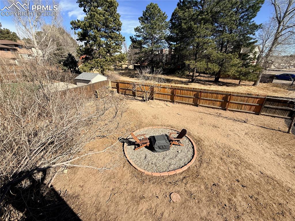 Image 33 of 48: Fenced backyard featuring a patio area