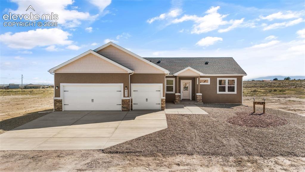 Image 1 of 40: Contemporary stucco exterior with stone accents