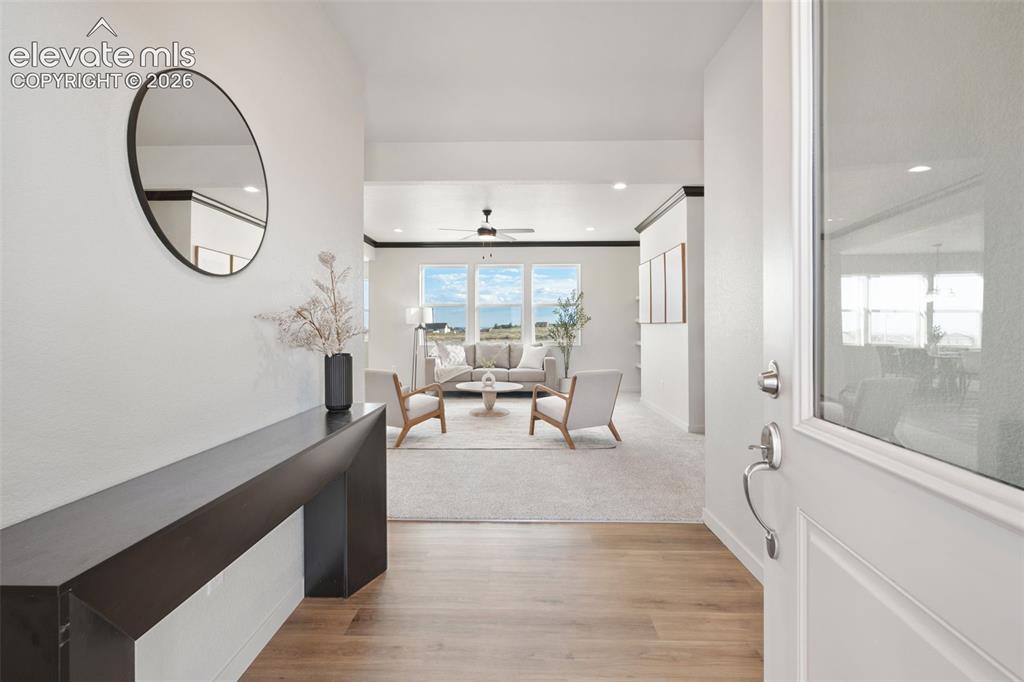 Image 3 of 40: Entryway featuring wood-finish flooring, a contemporary console table, and 