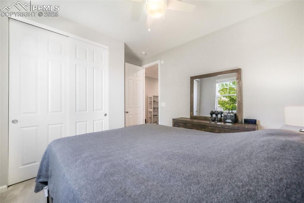 Image 10 of 47: 2nd bedroom with carpet and large closet