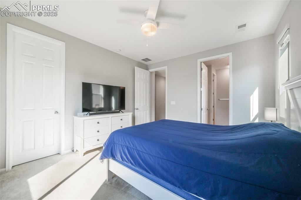 Image 26 of 47: Primary bedroom with large walk in closet and ensuite bathroom