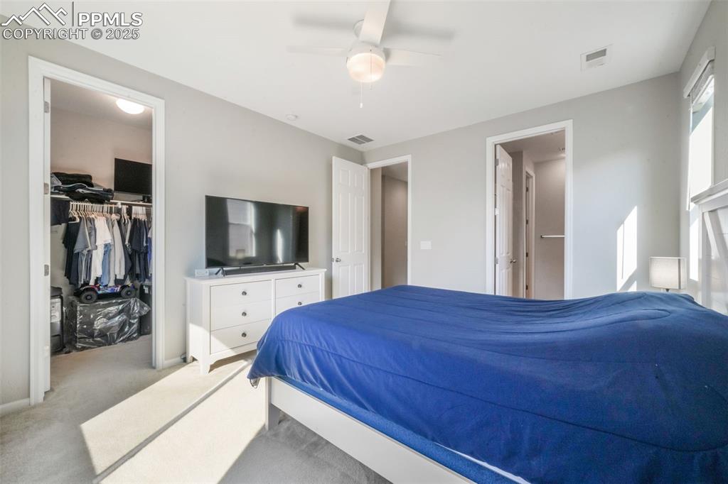 Image 27 of 47: Primary bedroom with large walk in closet and ensuite bathroom