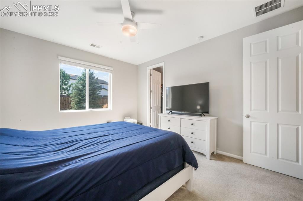 Image 28 of 47: Primary bedroom with large walk in closet and ensuite bathroom