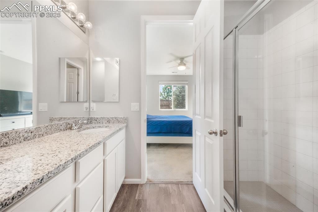 Image 29 of 47: Primary bathroom with large shower, granite counters and already plumbed fo