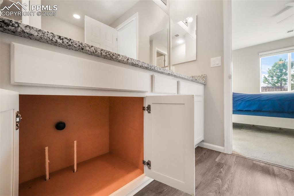 Image 31 of 47: Primary bathroom with large shower, granite counters and already plumbed fo