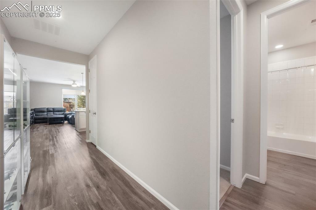 Image 4 of 47: Entry with LVP flooring, access to 2 bedrooms and full bathroom