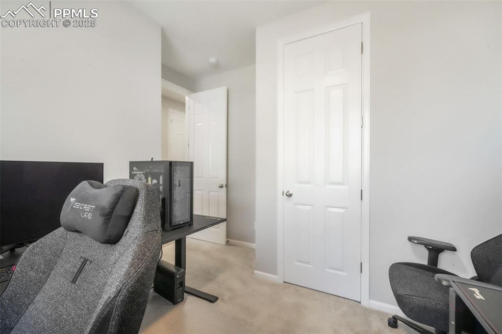 Image 6 of 47: 1st bedroom with carpet and large closet