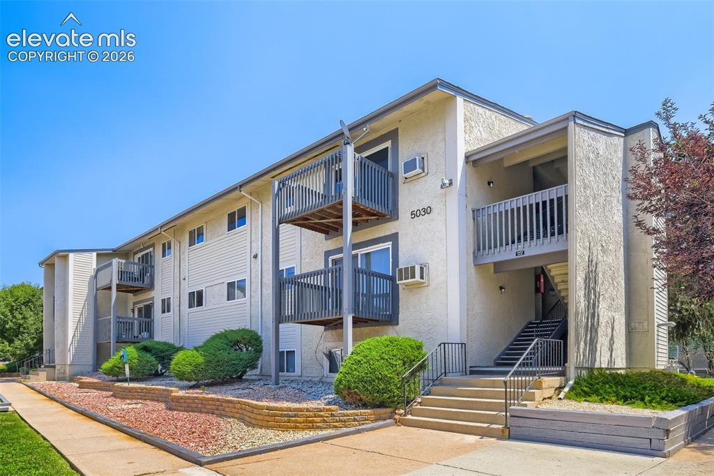 Image 2 of 38: Contemporary multi-unit residential building featuring clean-lined architec