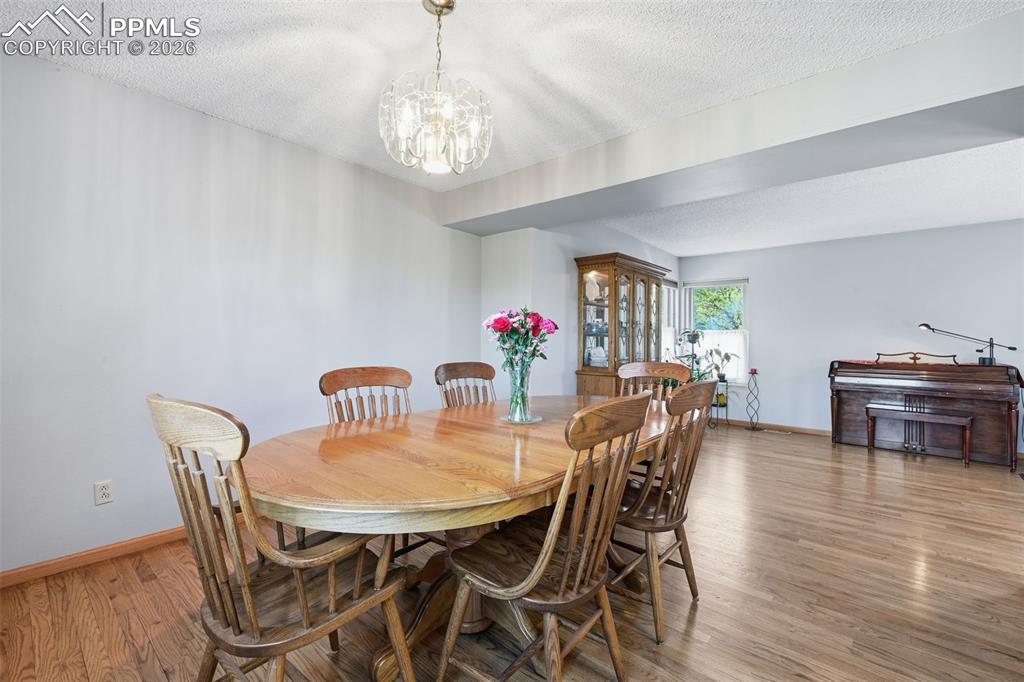 Image 10 of 49: This dining area is right off the kitchen and has view of the Front Range o