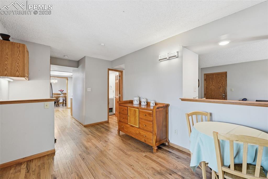 Image 17 of 49: This view shows the powder room on main level, the desk nook and and little