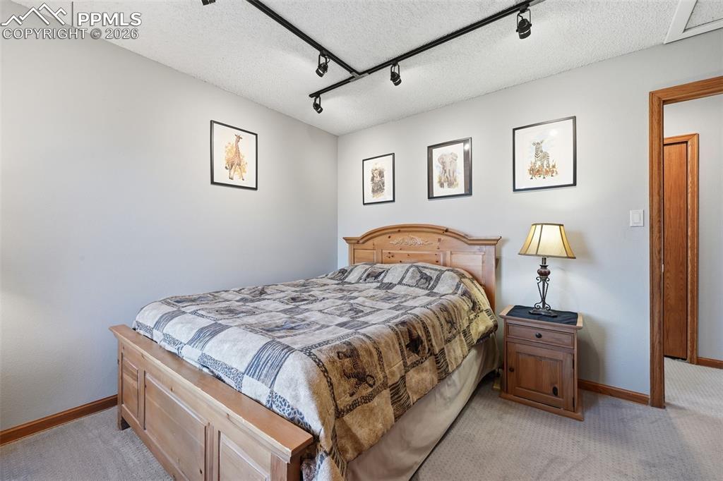 Image 23 of 49: Guest bedroom also looks out at Pikes Peak!