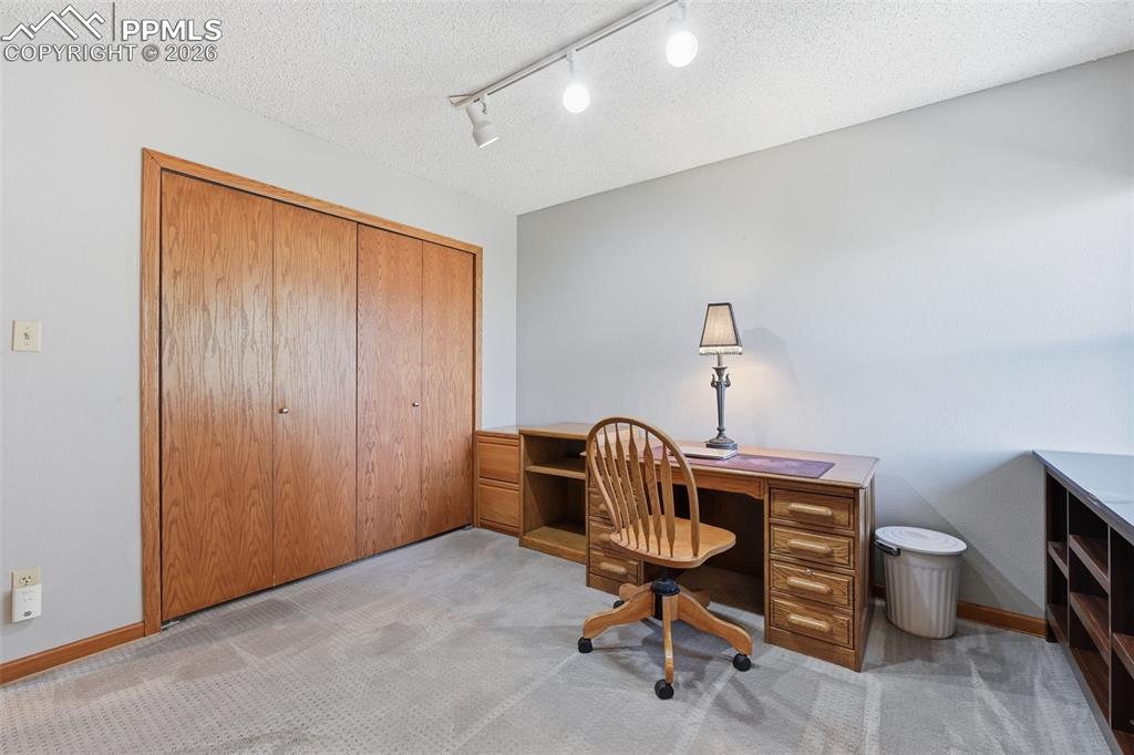 Image 28 of 49: Bedroom set up as an office...yes, this one looks out at Pikes Peak too!!!!