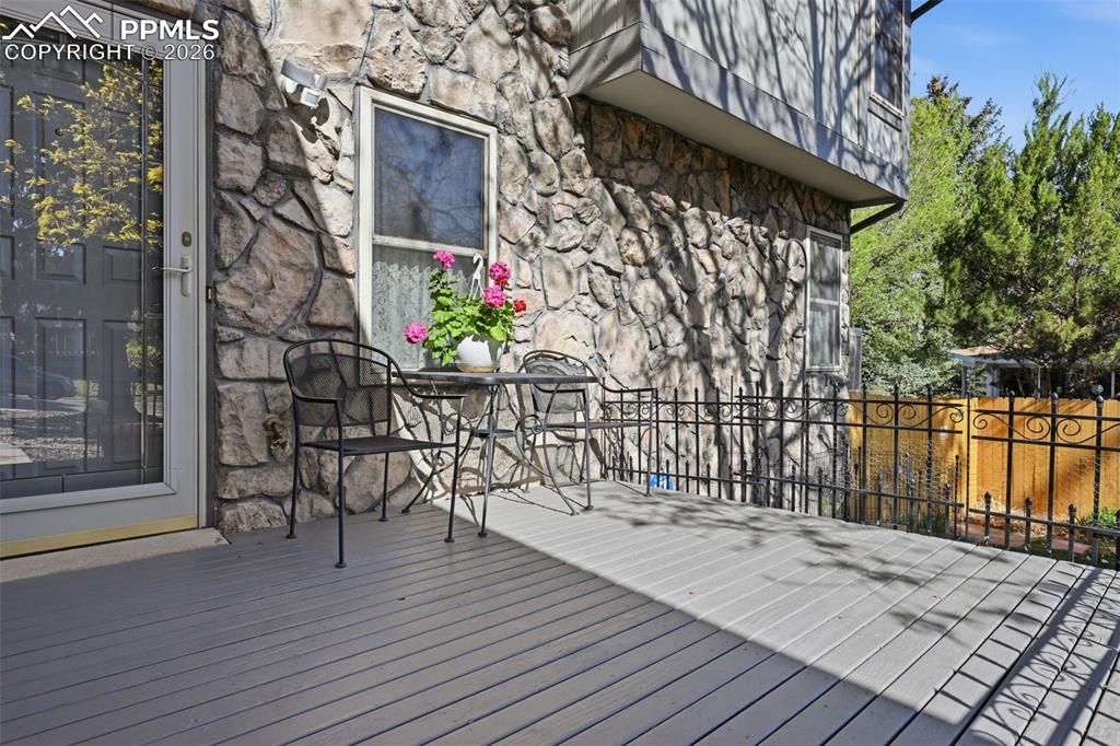 Image 3 of 49: Deck to front entrance, it gets some sun and some shade. Enjoy a cup of cof